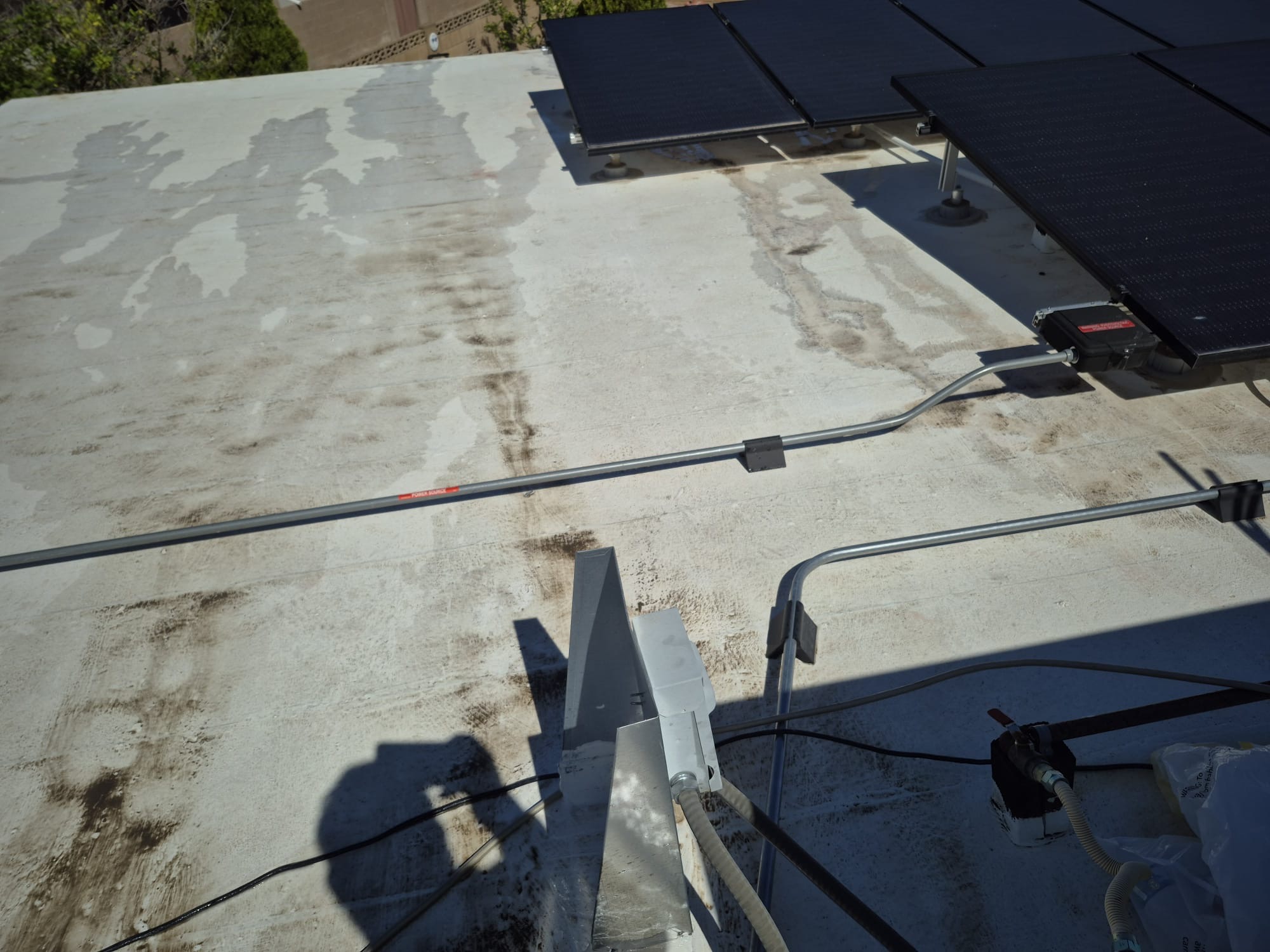 Ponding & Staining Under Solar, Flat Roof roofing project by Rob's Roofing & Remodeling