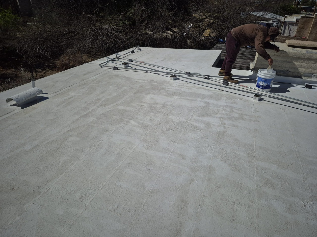 Base Coat Application, Flat Roof roofing project by Rob's Roofing & Remodeling