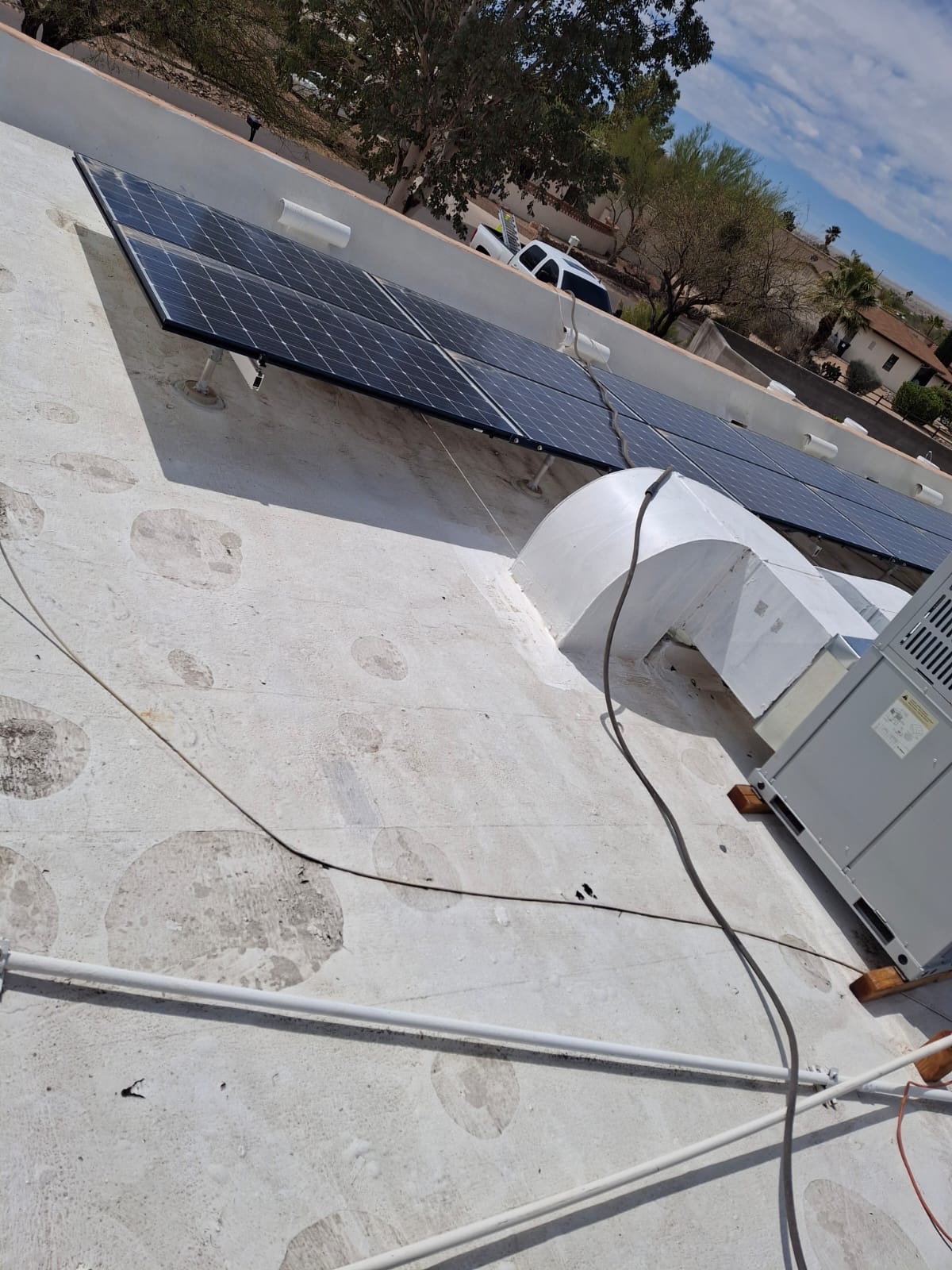 Weathered Flat Roof With Solar, Flat Roof roofing project by Rob's Roofing & Remodeling