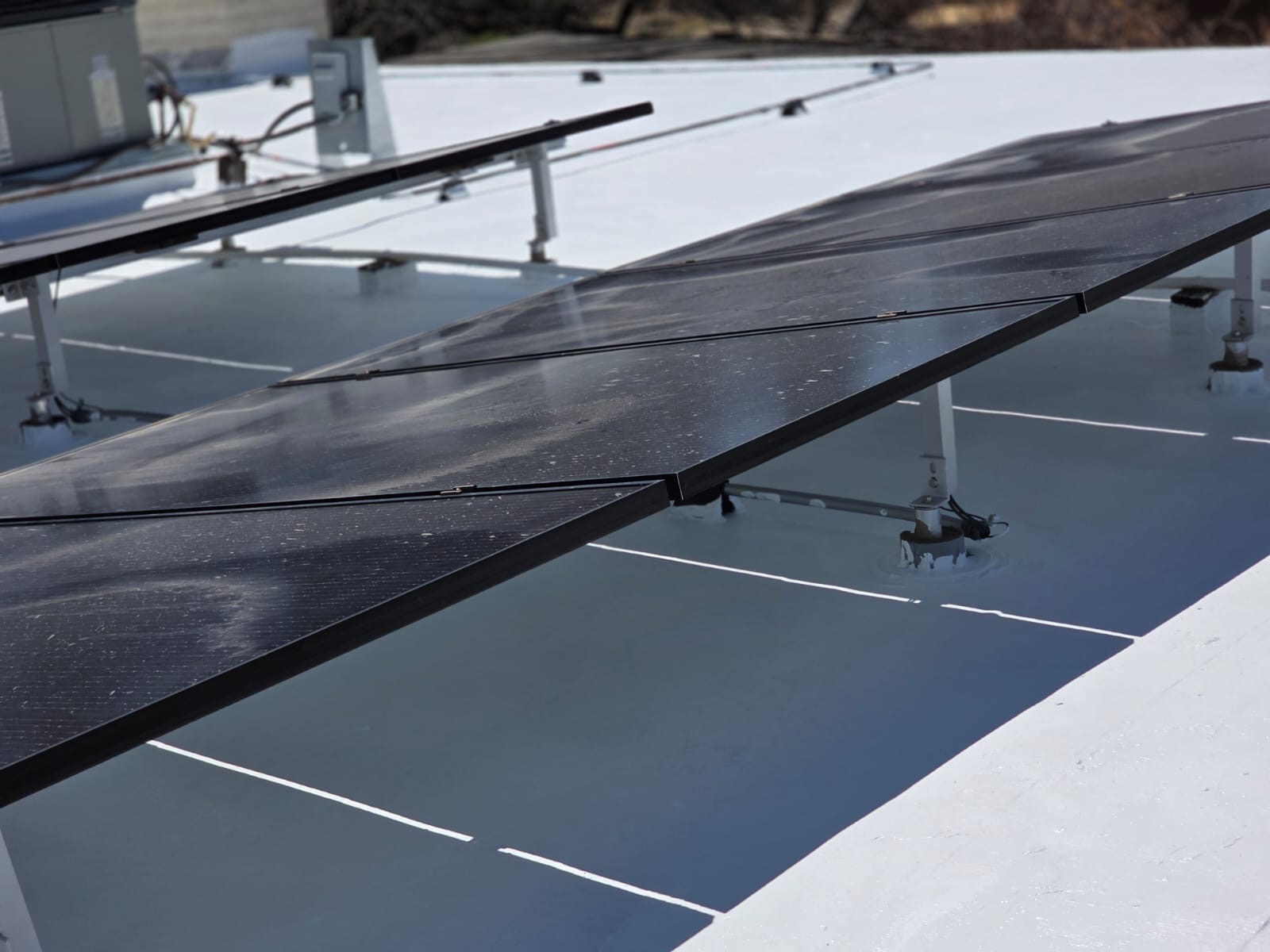 Solar Array On Fresh Coating, Flat Roof roofing project by Rob's Roofing & Remodeling