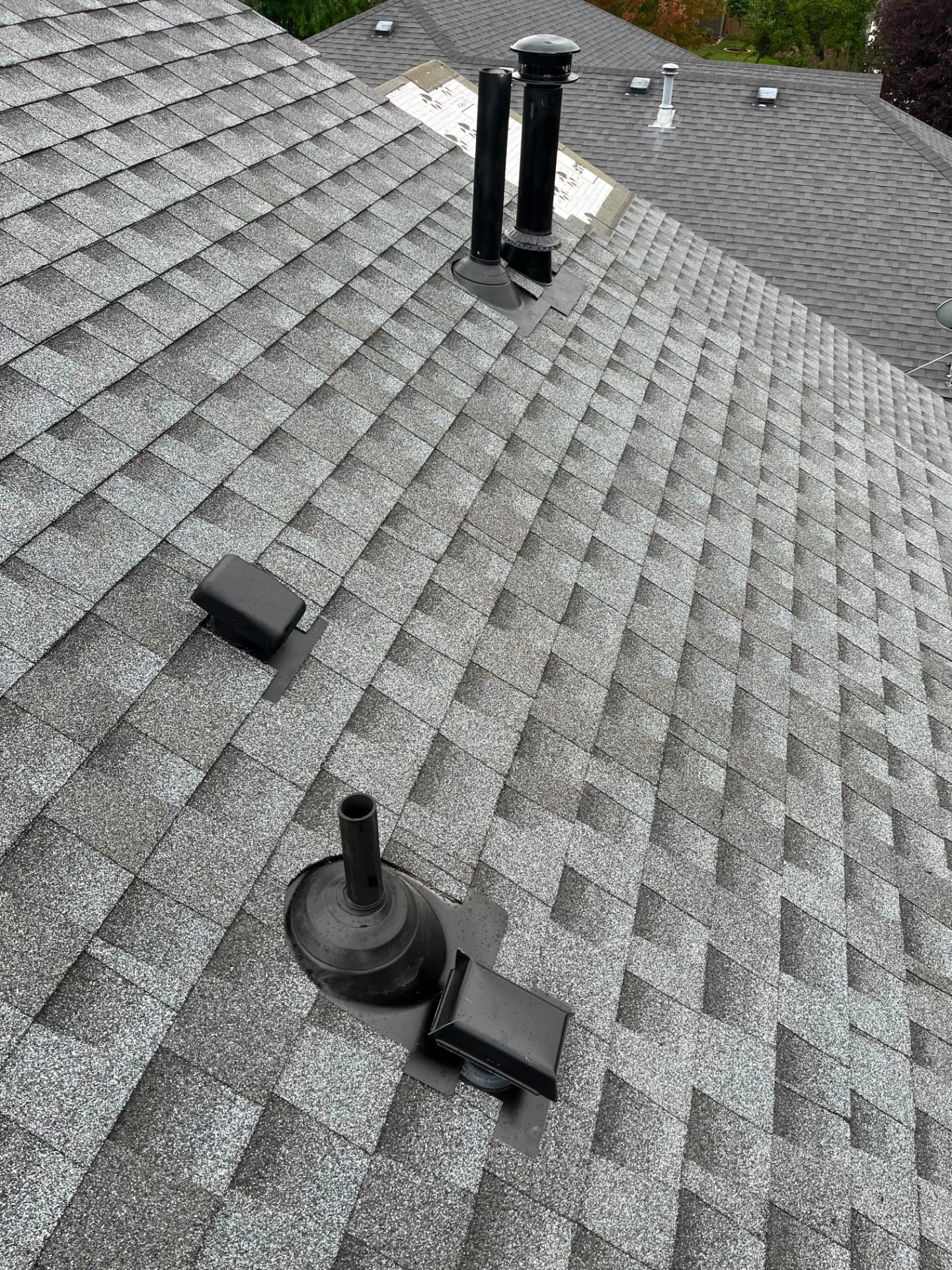 Shingle Field With New Vents, Shingle roofing project by Rob's Roofing & Remodeling